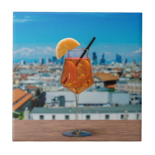 Spritz cocktail on a table with view of Milan Ceramic Tile