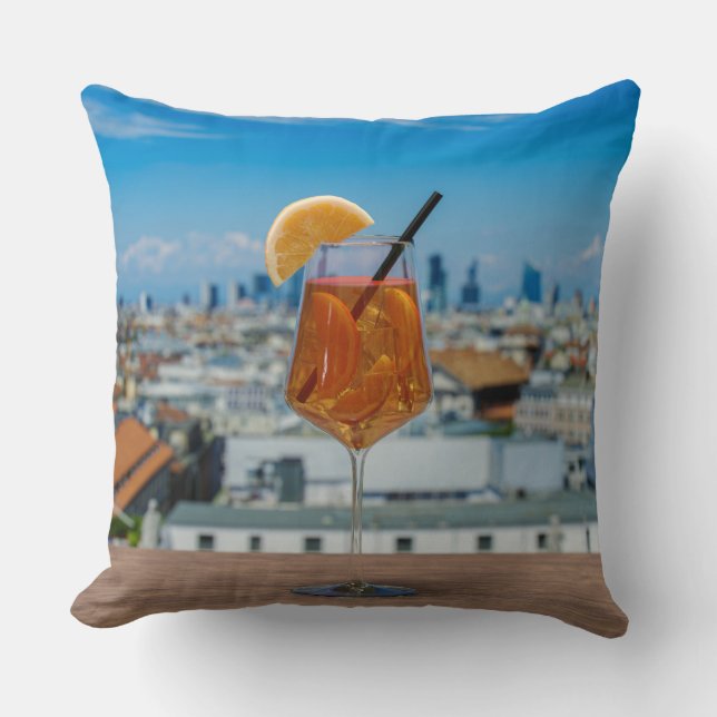 Spritz cocktail on a table with view of Milan Cushion (Front)