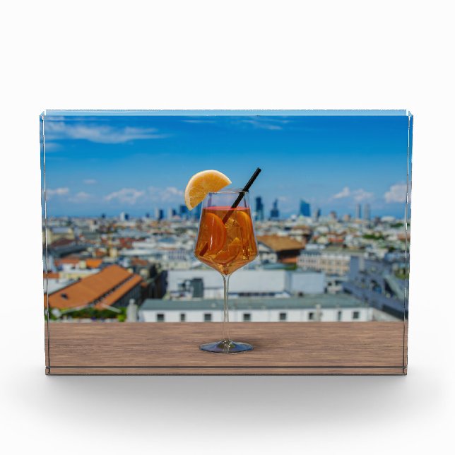 Spritz cocktail on a table with view of Milan Photo Block (Front)
