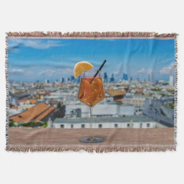 Spritz cocktail on a table with view of Milan Throw Blanket (Front)