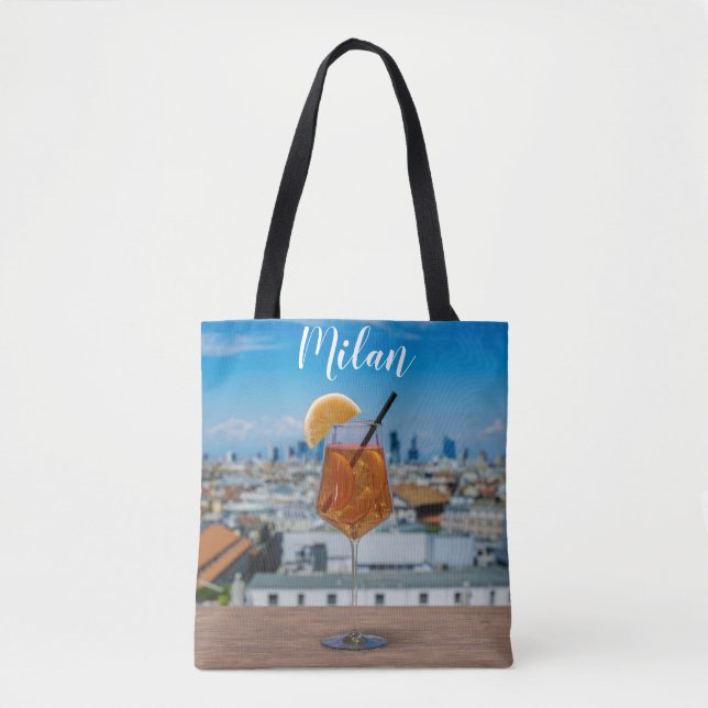 Spritz cocktail on a table with view of Milan Tote Bag (Front)