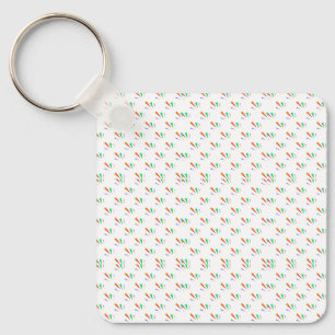 Square keychain with "M" pattern in green, orange,