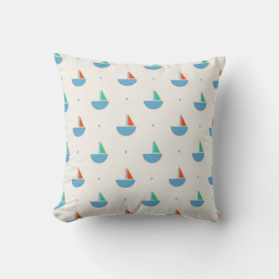 Square pillow with sailboat pattern