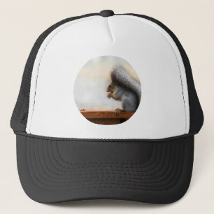 Squirrel on a bench and some nuts trucker hat