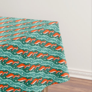 Squirrels jumping in the snow on a Christmas tree Tablecloth