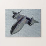 SR-71B BLACKBIRD (11x14 INCH) Jigsaw Puzzle<br><div class="desc">The SR-71 Blackbird is a long-range, high-altitude, Mach 3 strategic reconnaissance aircraft. During aerial reconnaissance missions, the SR-71 operated at high speeds and altitudes (85, 000 feet) to allow it to outrace threats. If a surface-to-air missile launch was detected, the standard evasive action was simply to accelerate and outfly the...</div>