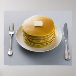 Stack of pancakes with butter on a plate poster
