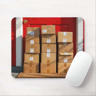 Stacked Cardboard Boxes By a Red Door Mouse Pad