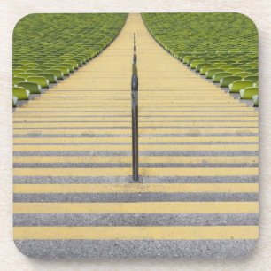 Stadium stairway between rows of green seats coaster