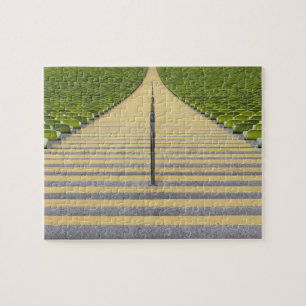 Stadium stairway between rows of green seats jigsaw puzzle