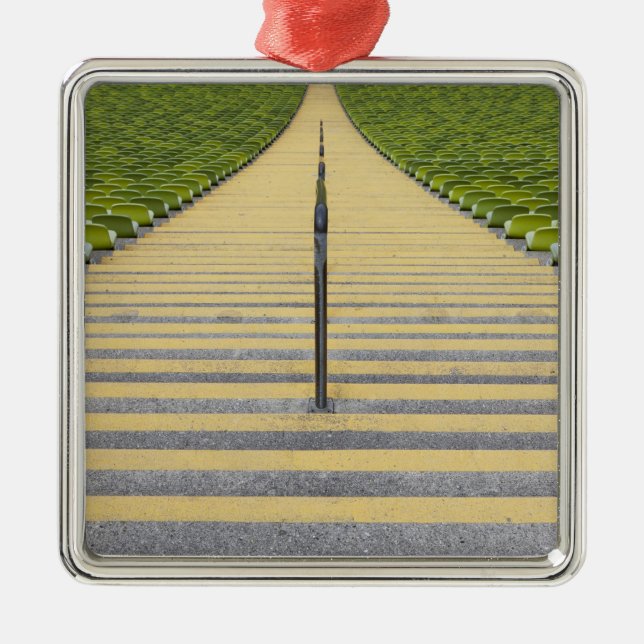 Stadium stairway between rows of green seats metal ornament (Front)