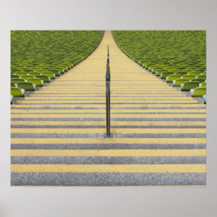 Stadium stairway between rows of green seats poster