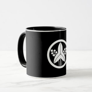 Standing arrowhead in a circle coffee mug
