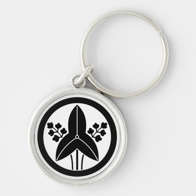 Standing arrowhead in a circle keychain (Front)