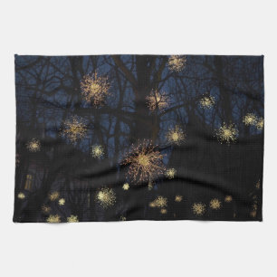 Starburst lights in trees, night holiday kitchen tea towel