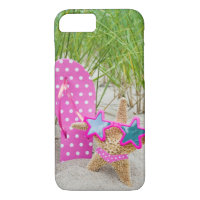 starfish and flip-flops in sand