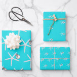 Starfish and Ornament Beach Christmas Patterned Wrapping Paper Sheet<br><div class="desc">Starfish and ornament pattern Christmas wrapping paper sheets. Bright aqua blue colour paper with white sea stars. Each sheet in the set has a different size starfish pattern. Each sea star has a little silver white ornament hanging from one of it’s legs. Perfect for gift giving in a warm climate....</div>