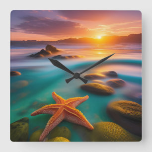 Starfish on beach at Dawn Square Wall Clock