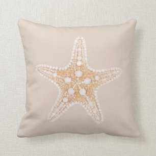 Starfish on beige pastel light brown cushion