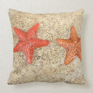 starfish on the beach, at the edge of the ocean cushion