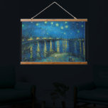 Starry Night Over the Rhône | Vincent van Gogh Hanging Tapestry<br><div class="desc">Starry Night Over the Rhône (1888) by Vincent van Gogh is a mesmerising Post-Impressionist painting that captures a serene nighttime view of the Rhône River in Arles, France. The artwork features a deep blue sky adorned with shimmering golden stars and their reflections on the water. In the foreground, two figures...</div>