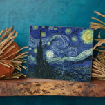 Starry Night Vincent van Gogh Fine Art Painting Plaque<br><div class="desc">Vincent van Gogh (Dutch, 1853 - 1890) Starry Night, 1889, Oil on canvas Unframed: 73 × 92 cm (28.7 × 36.2 in) This painting depicts the view from the east facing window of Van Gogh's asylum room at Saint-Rémy-de-Provence, he added an idealised village. It has been in the permanent collection...</div>