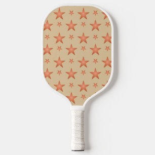 Starry pattern in gradient terracotta orange pickleball paddle