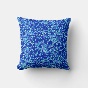 Stars, shades of pale blue against dark blue cushion