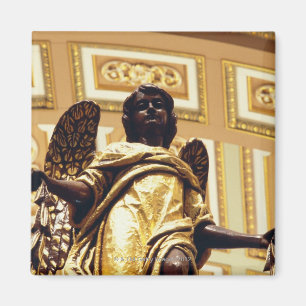 Statue of angel in gold magnet