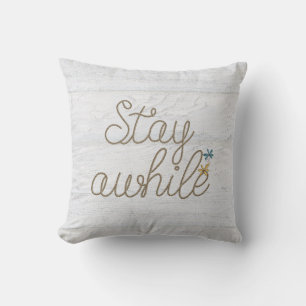 Stay Awhile nautical rope text on rustic wood Cushion