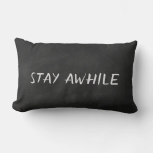 Stay Awhile quote on black chalkboard Lumbar Cushion
