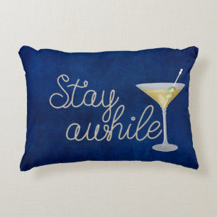"stay awhile" rope on blue decorative cushion