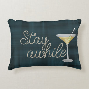 "stay awhile" rope on plaid decorative cushion