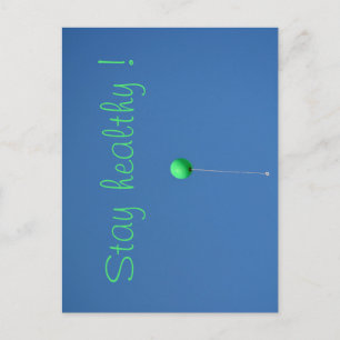 Stay healthy with green balloon in the sky postcard