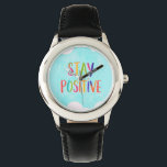 Stay positive motivational quote painted watch<br><div class="desc">Multi-color painted typographic words stay positive on watercolor blue background design.</div>
