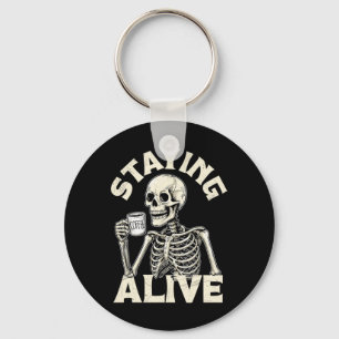 Staying Alive Funny Halloween Skeleton Drinking Co Key Ring