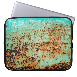 steel surface. An old weathered Green Laptop Sleeve