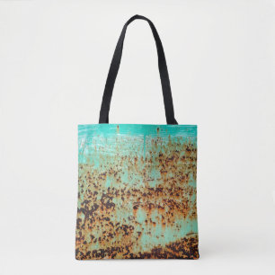 steel surface. An old weathered Green Tote Bag