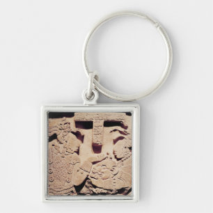 Stela depicting a woman presenting a jaguar mask key ring