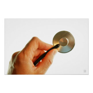 Stethoscope in a hand for a hospital atmosphere. poster