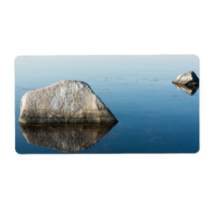 Stone and its reflection at sea surface