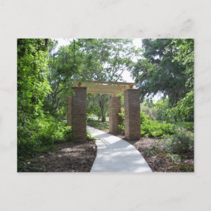 Stone and wood pergola in a park postcard