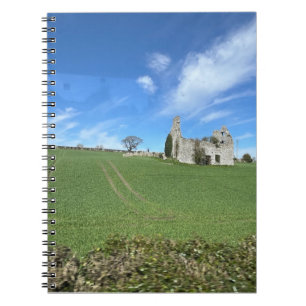 Stone building in green field Irish countryside Notebook