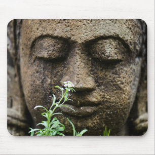 Stone garden statue with flower mouse pad