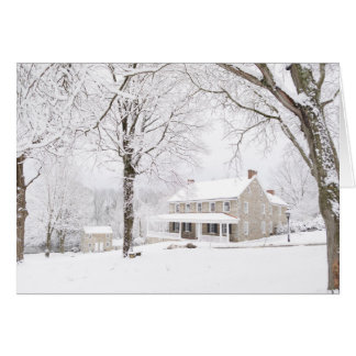 Stone mansion and Still house in snow
