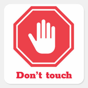 Stop sign with the expression “don’t touch” square sticker