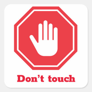 Stop sign with the expression “don’t touch” square sticker