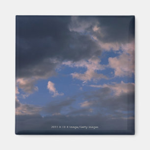 Storm clouds against blue sky magnet