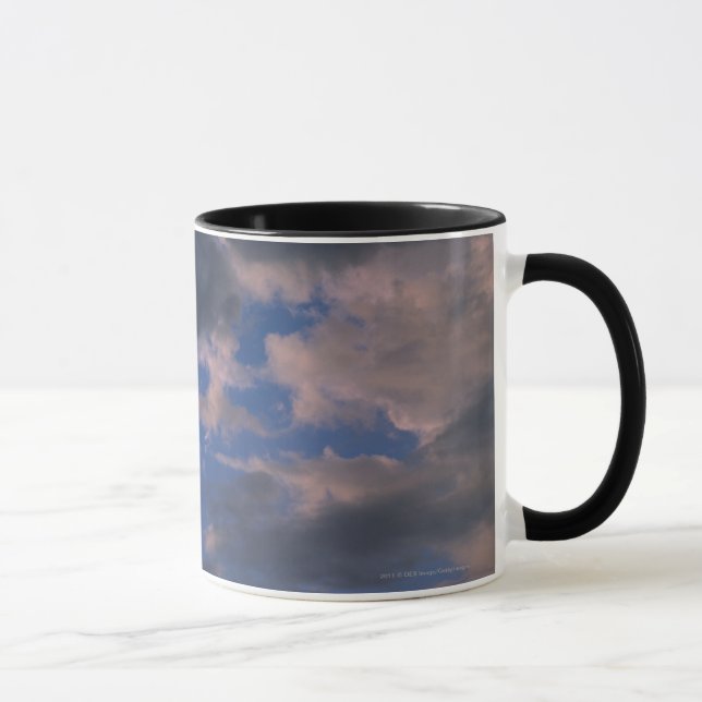 Storm clouds against blue sky mug (Right)