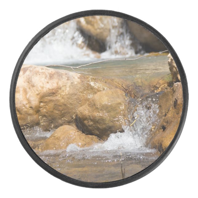Stormy stream in spring hockey puck (Front)